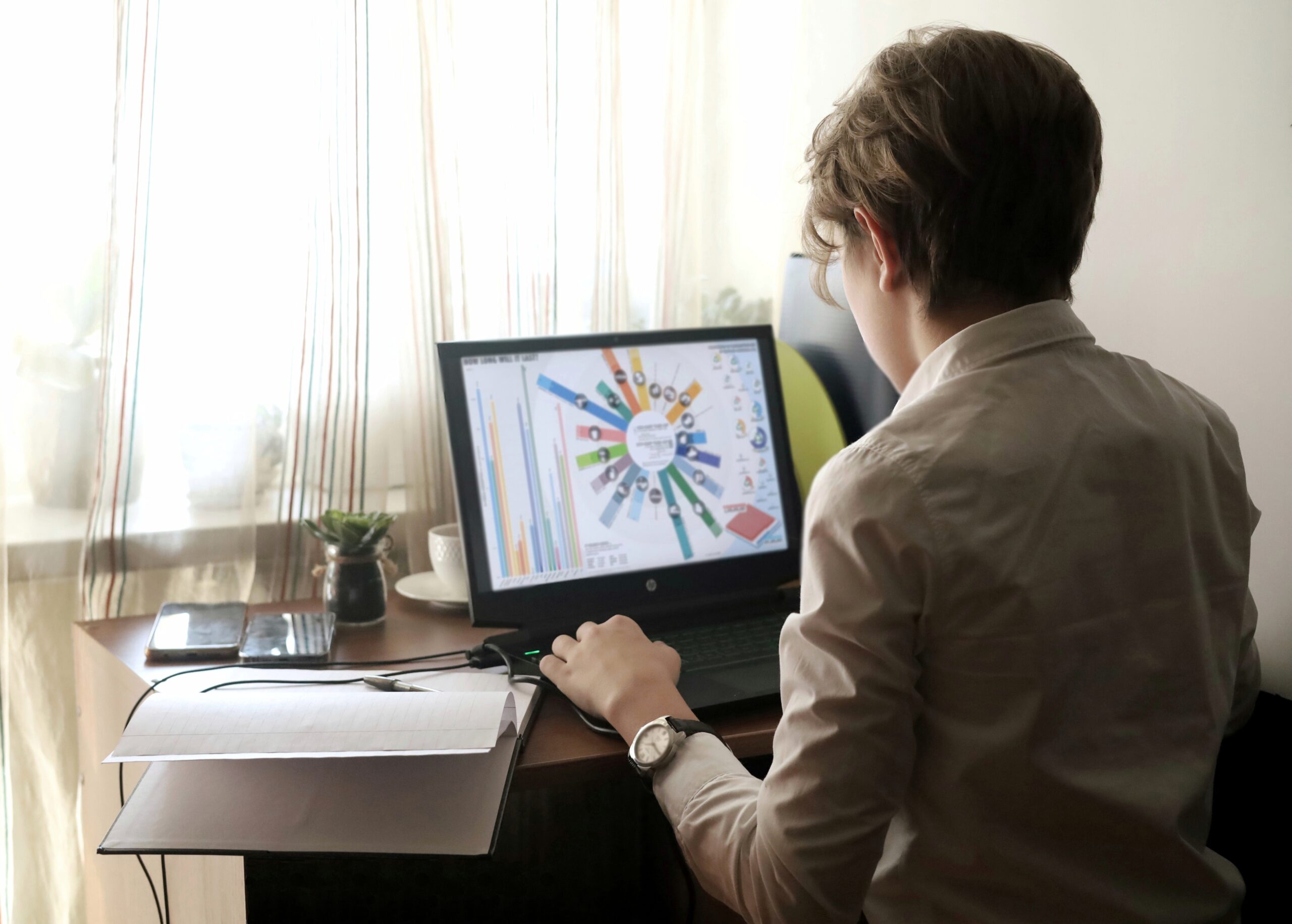 a-young-aspiring-businessman-sits-in-front-of-his-2025-01-07-23-40-05-utc