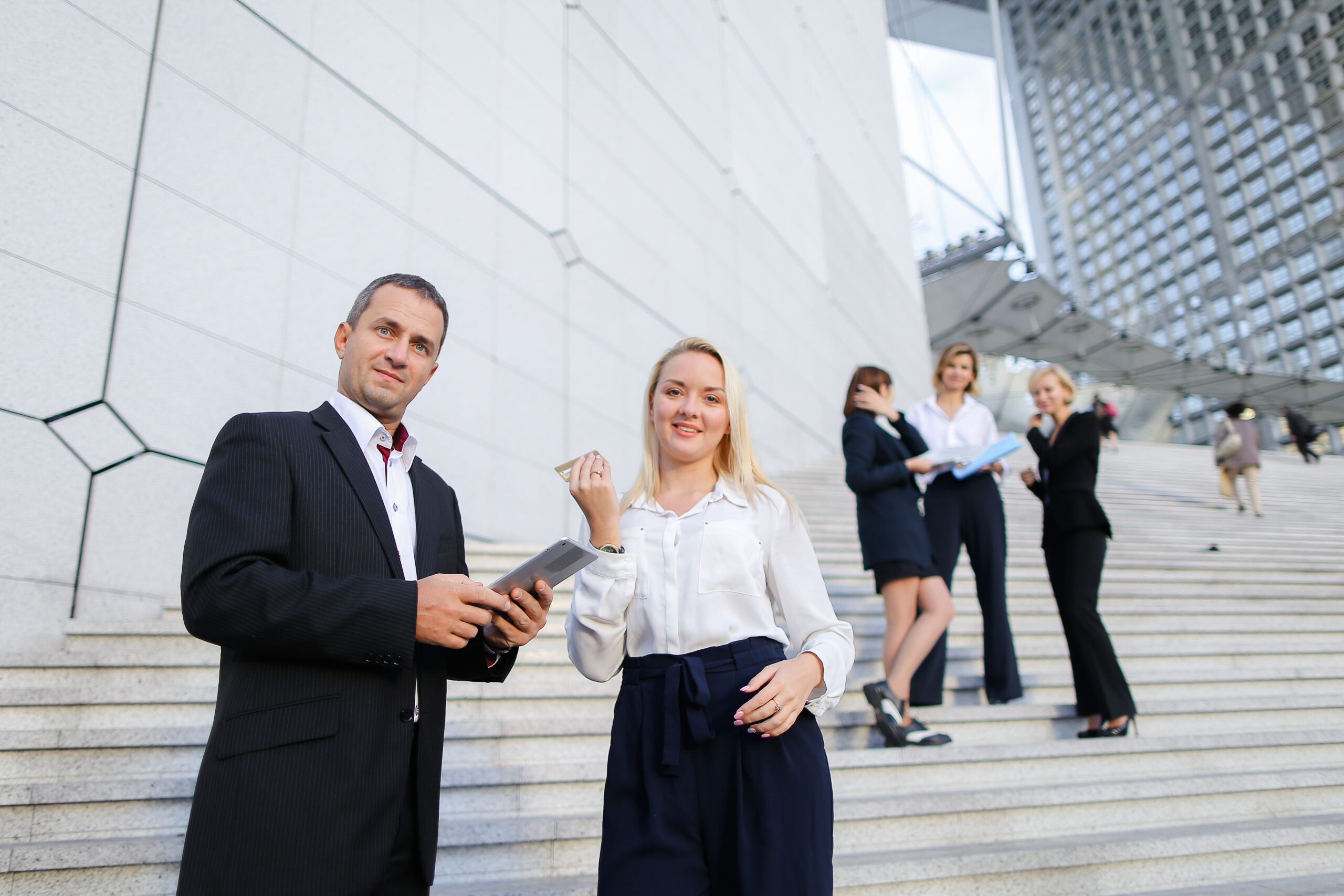 boss-keeping-tablet-and-speaking-with-blonde-secre-2025-10-16-23-33-25-utc