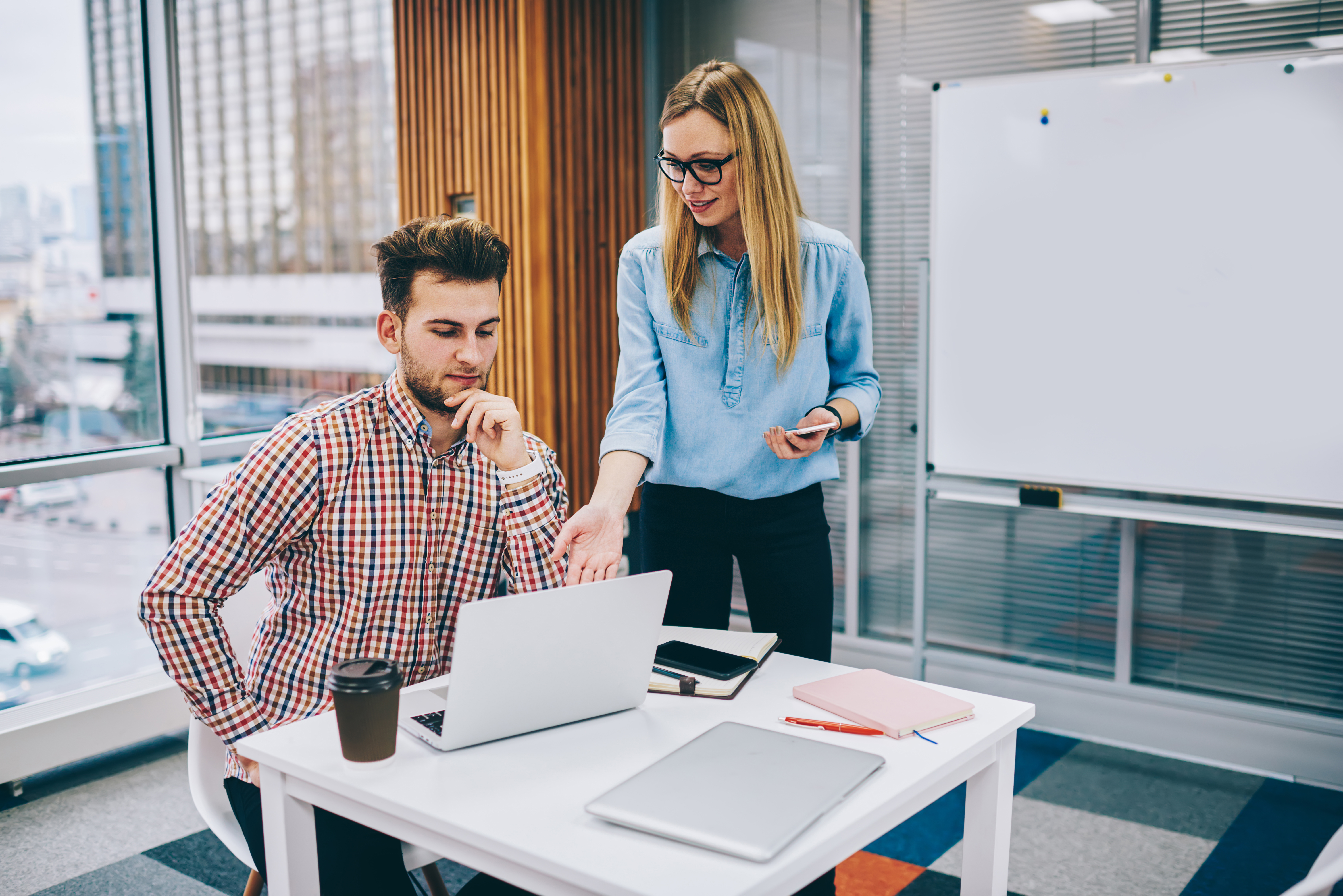 Colleagues discussing new project in office