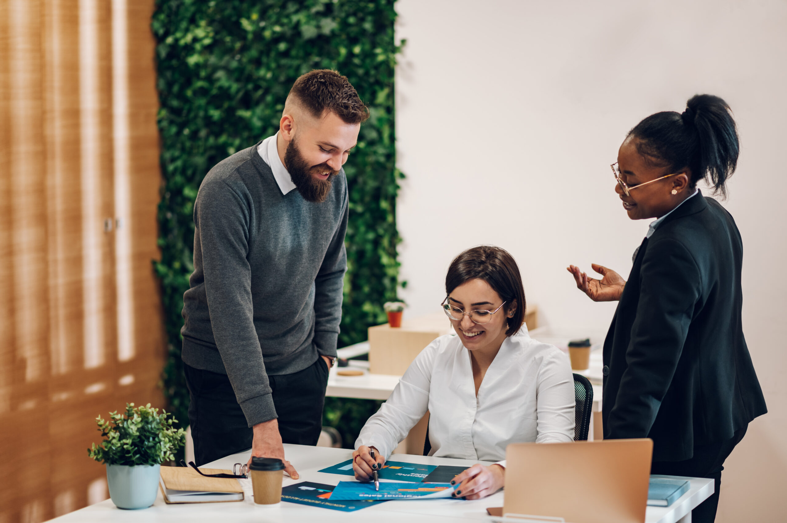 Multicultural team working together in office and having a meeti